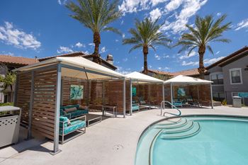 Sundeck with poolside cabanas and lounge seating